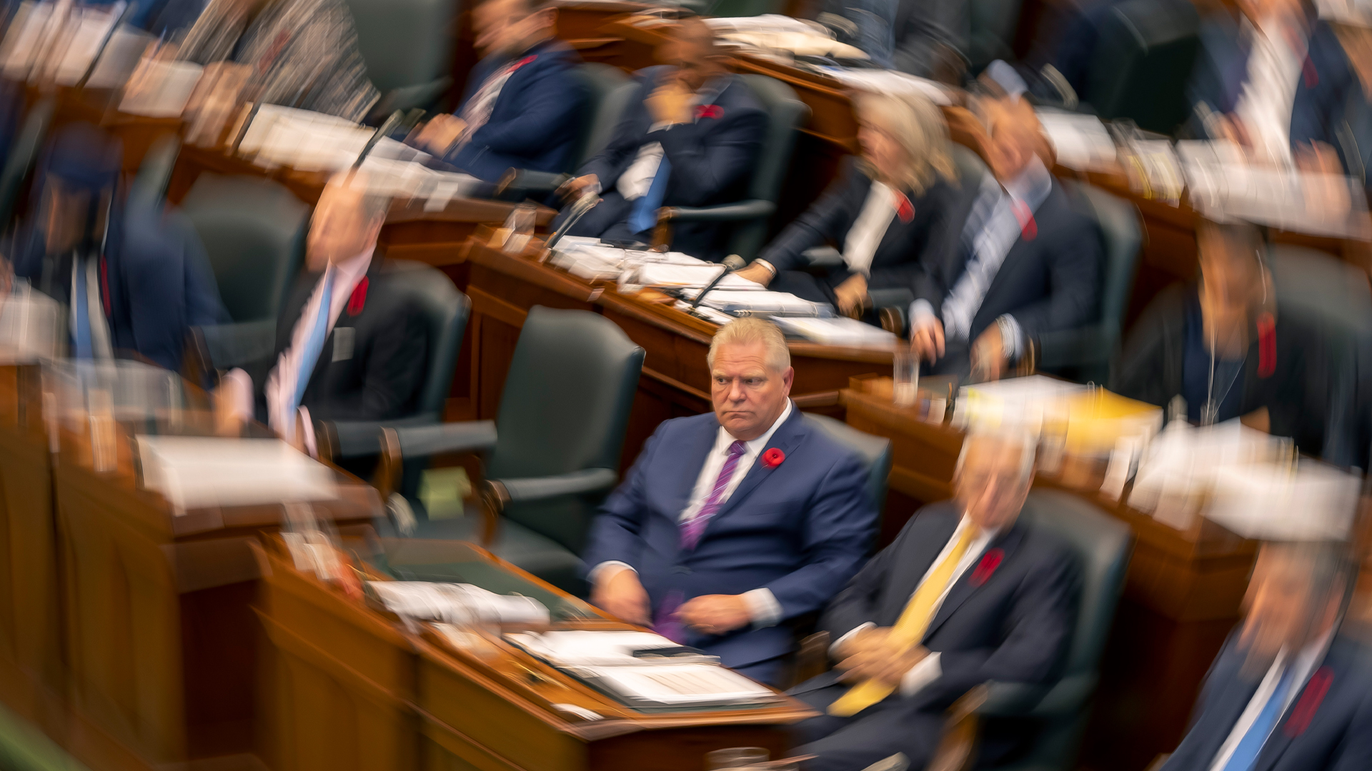 Ontario Premier Doug Ford sits in the Ontario Legislature during Question Period on Tuesday November 1, 2022. The premier is in focus in the image while other members of the legislature are out of focus.