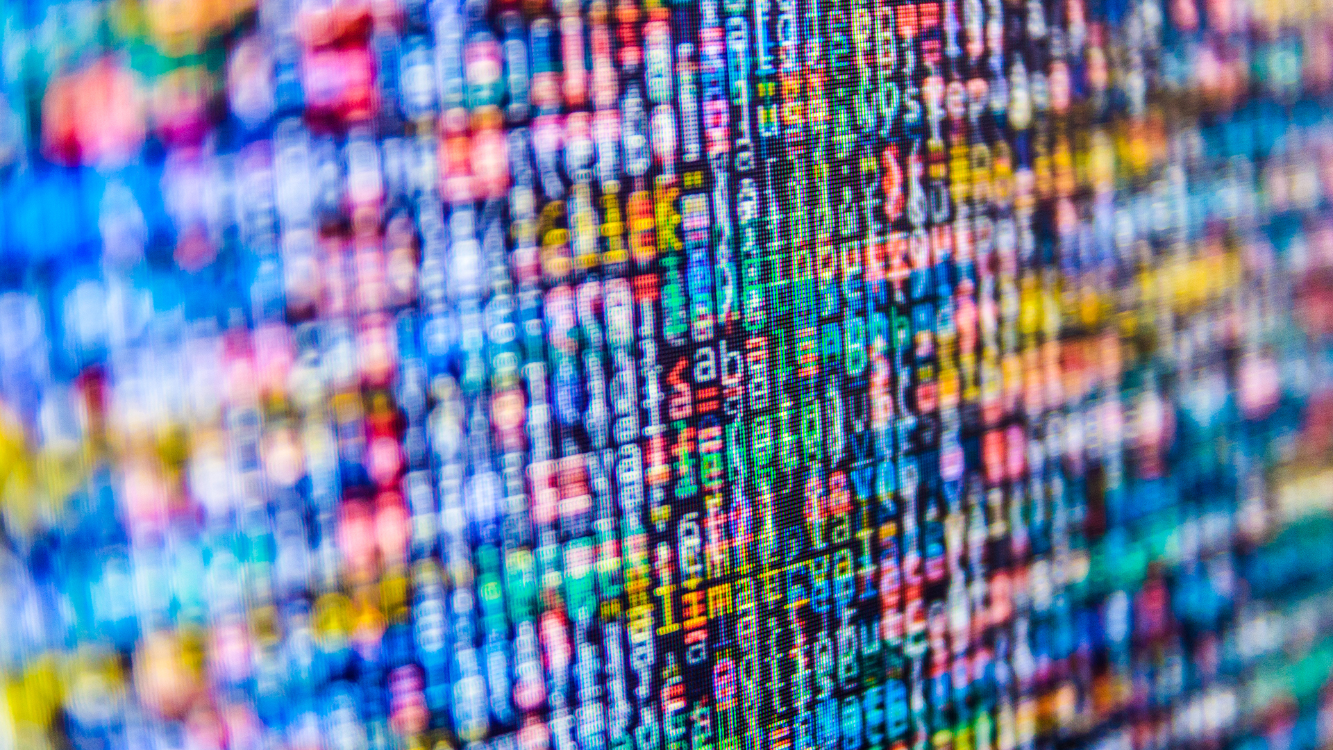 An abstract image of pixelated multicolour characters representing a stream of data.