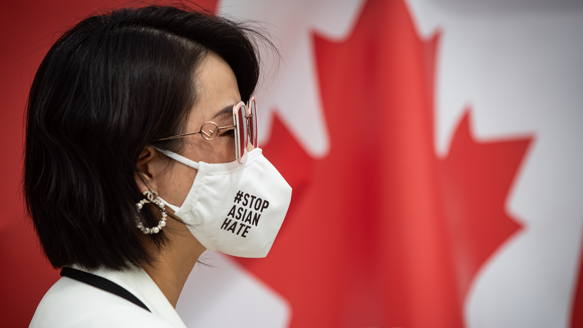 Li’s face mask is white has the sentence "Stop Asian Hate" printed in black on it.