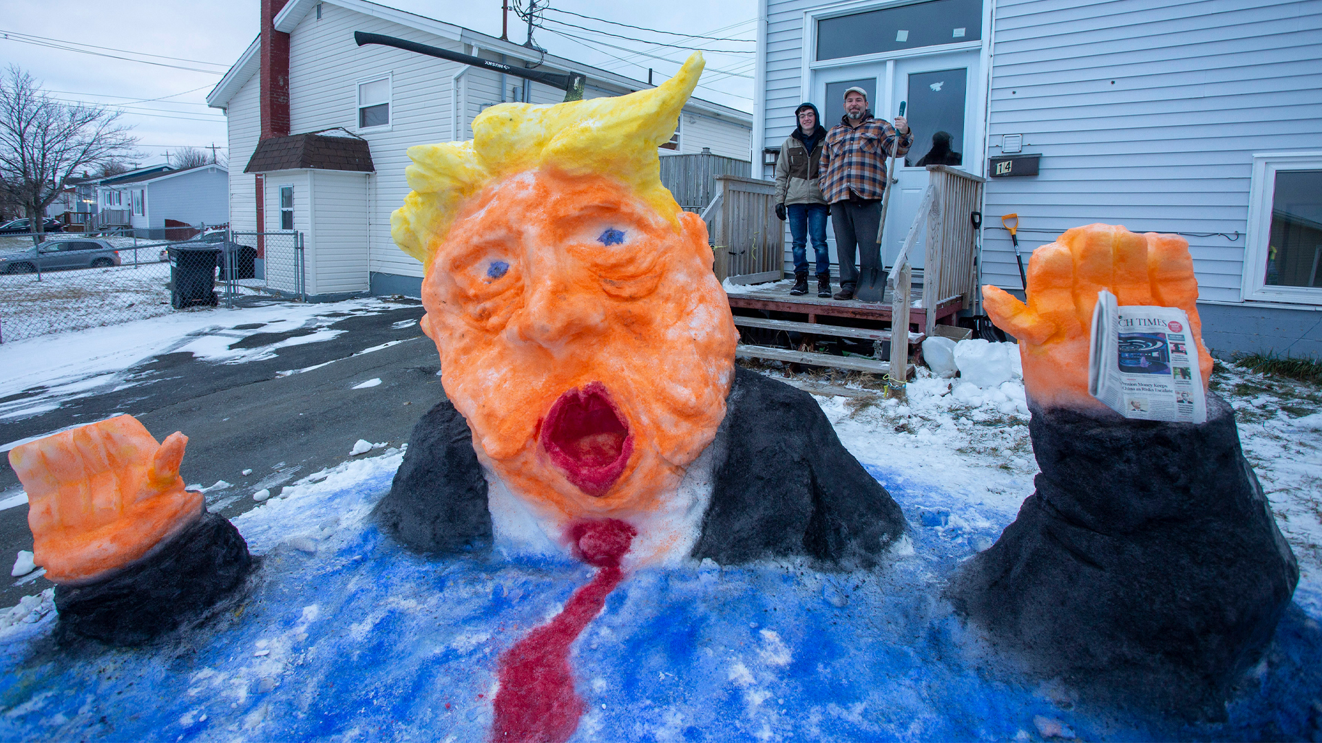 A snow sculpture of U.S. President Donald Trump shows him dissolving into water.